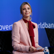 Ivanka Trump, in a pussy bow blouse, participating in an event at the annual meeting of the International Monetary Fund and World Bank.
